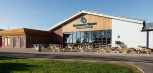 Badger's Barn bar and restaurant at Grange Leisure Park near Mablethorpe, Lincolnshire, designed by Norfolk architects Paul Robinson Partnership. A modern facilities building set within a landscaped holiday destination