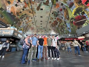 Group photo of colleagues from Paul Robinson Architects at the Markthal in Rotterdam
